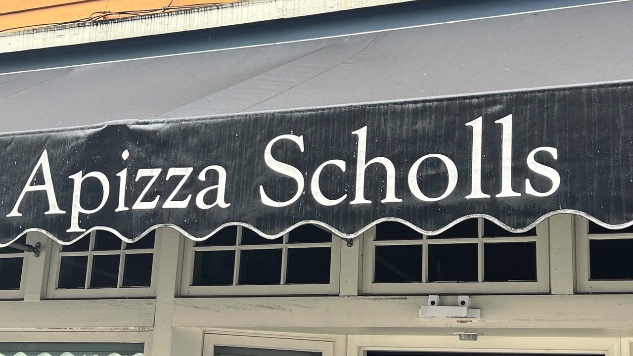 The classic and understated canopy of Apizza Scholls, a haven for pizza enthusiasts seeking perfection